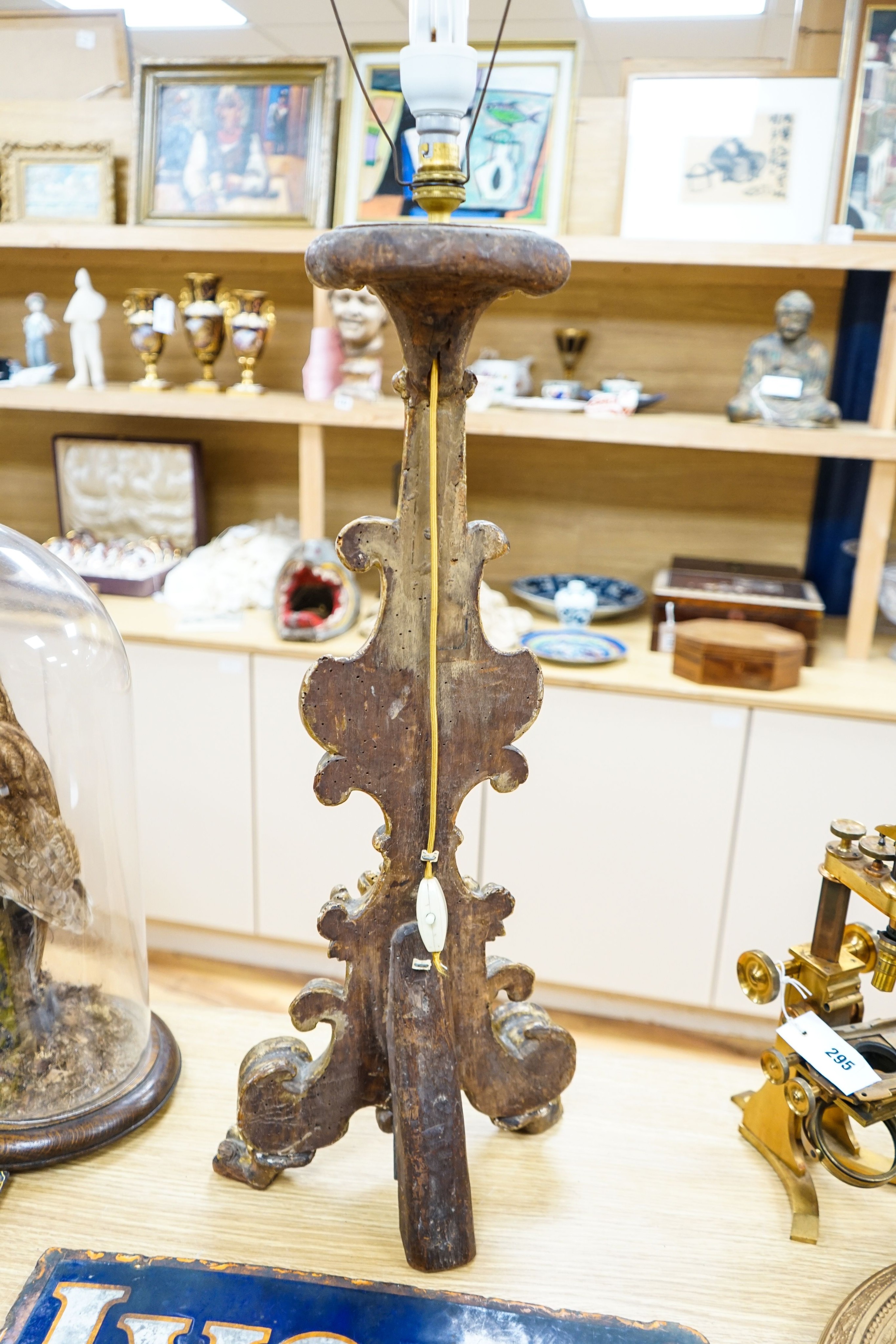 An 18th century Italian giltwood candlestand, foliate and scroll-carved